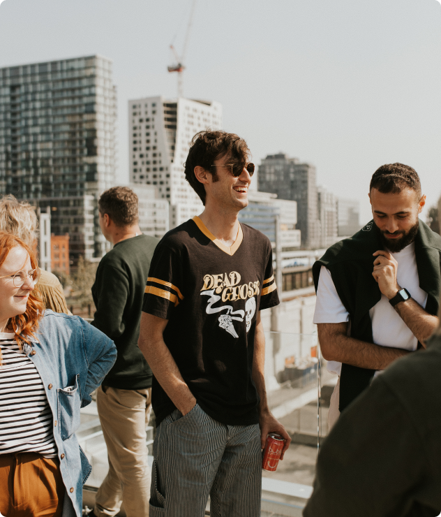 image of employees on a rooftop talking